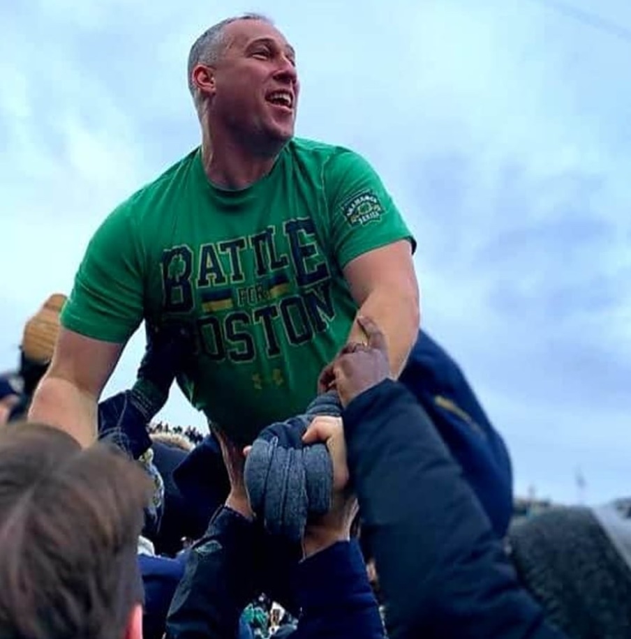 Stephen Ziegler celebrating with fans at a Notre Dame football game